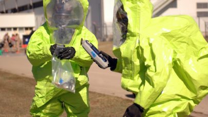 workers in hazmat suits after chemical exposure, representing the article "What is Toxic Tort Law?" by MMRBH Law Office.