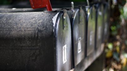 A row of mailboxes, one of which may have a subpoena in it