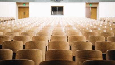 Rows of seating in a college auditorium, meant to represent the article "How to Prepare Your Child for College" by MMRBH Law Office.